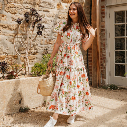 The Rosehip Design Grace Cotton Dress is a maxi style dress made of 100% Cotton Poplin.

Stylishly designed with buttons down the front, a tuck between tiers, short sleeves, and of course, side pockets.
