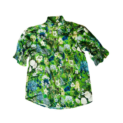 Rosehip Design Hannah Cotton Shirt in Spring Greens is a timeless blend of elegance and comfort. Made from soft cotton, it features a delicate frilled collar and intricate smocking on the sleeves for a touch of vintage charm. Designed for effortless styling, it pairs beautifully with the matching Bella Skirt.