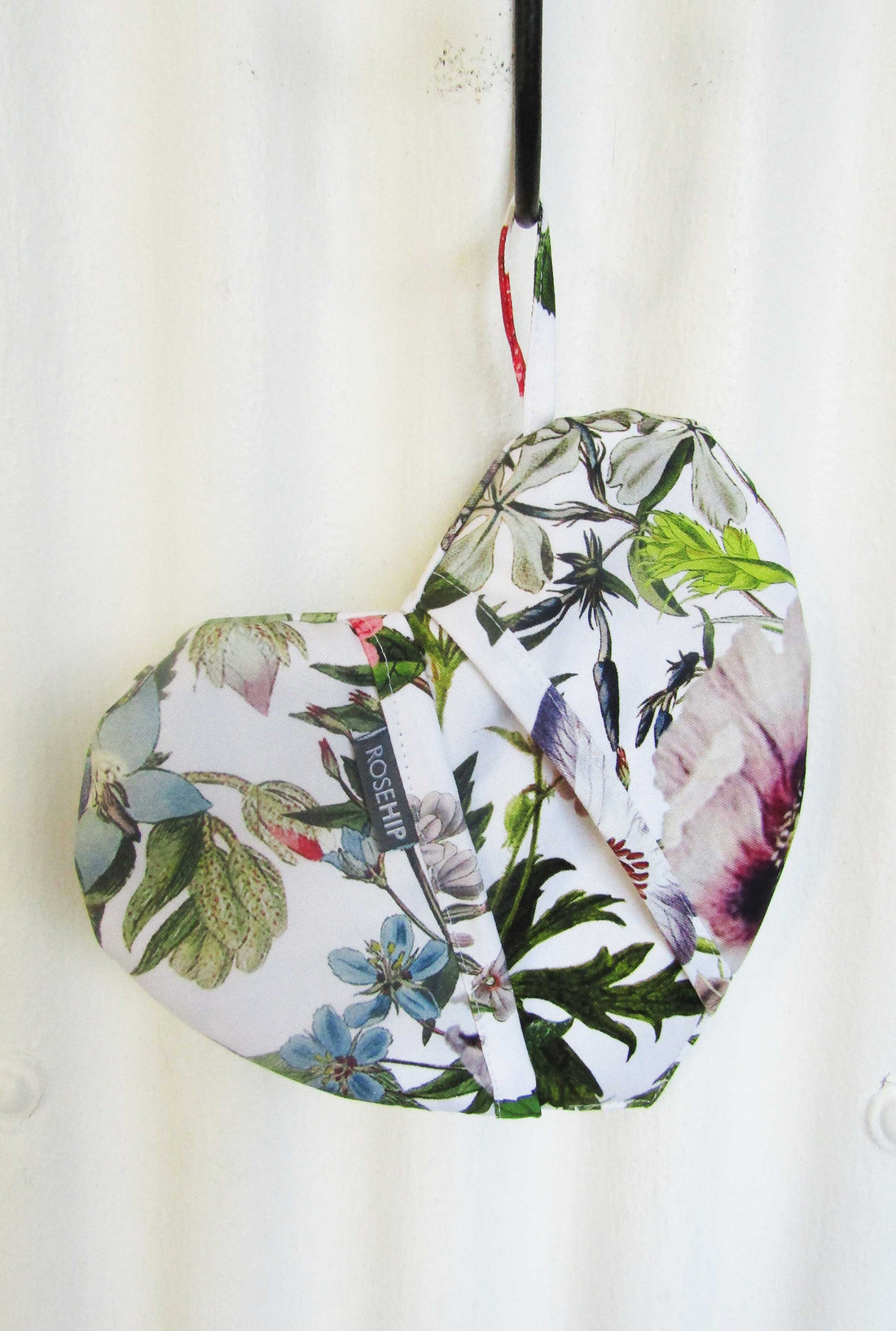 Rosehip Design Heart Potholder. A lovely heart shaped potholder/oven mitt in our pretty Pansies design. Padded with loop to hang on a hook. Matching aprons available.