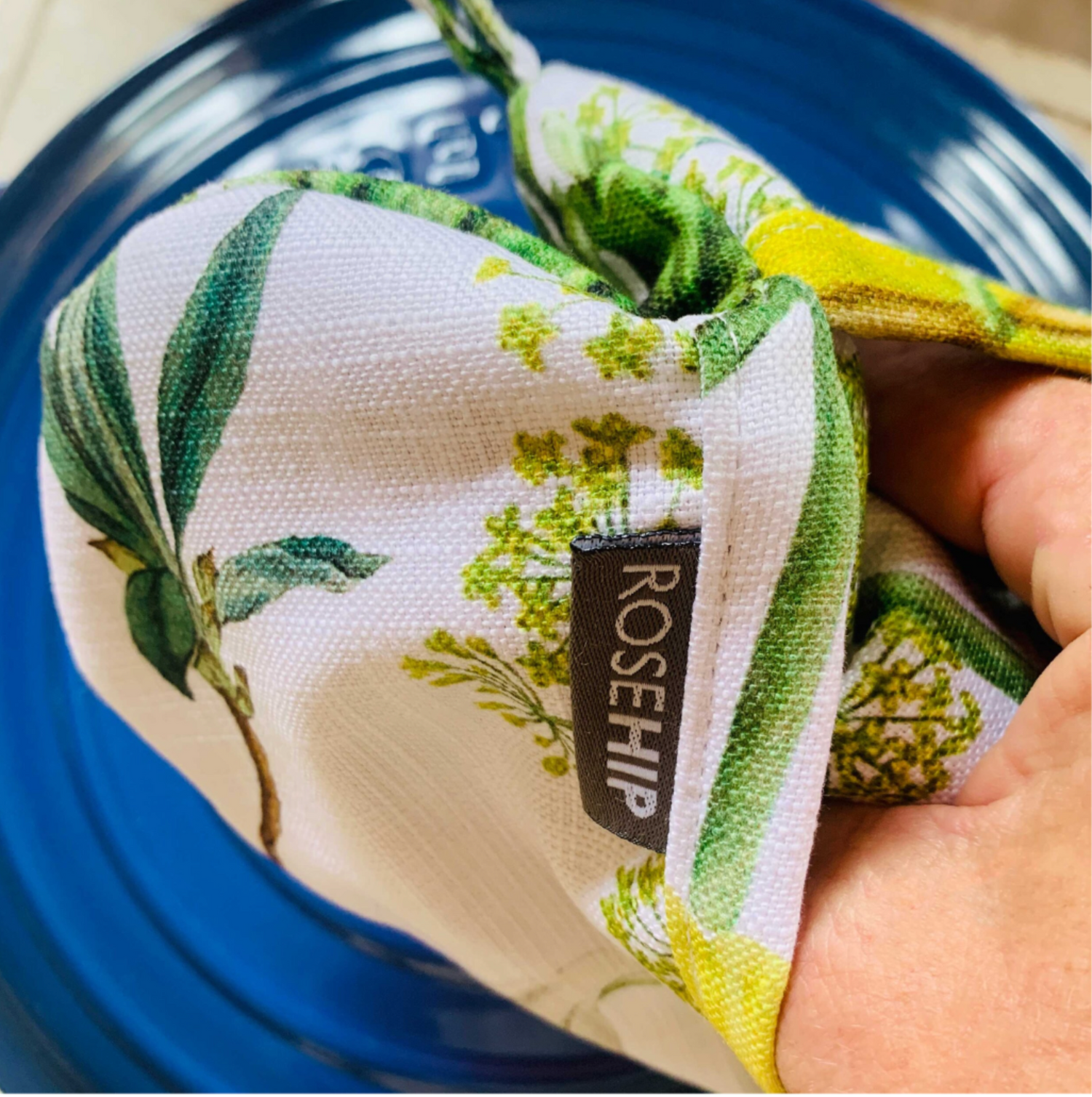 Rosehip Design Heart Potholder. A lovely heart shaped potholder/oven mitt in our lovely Springtime Blue design. Padded with loop to hang on a hook. Matching aprons available.