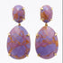 A pair of gold drop earrings featuring faceted oval purple and orange marbled stones, displayed on a clean white reflective surface.
