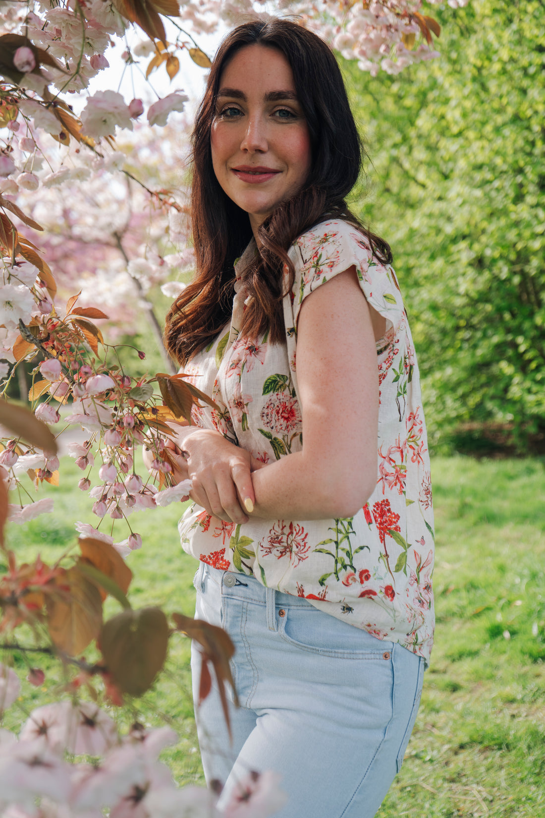 Light, breathable, and effortlessly stylish — the Jemma Shirt from Rosehip Design is made from 100% pure linen and finished with our soft floral Spring Blossom print. Designed with a neat collar, a partial button front, and gently capped sleeves, it&
