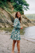 Rosehip Design Josie Cotton Dress is a knee-length cotton tiered dress with a tie belt and pockets.

Make a glamorous entrance in our breezy Camelia Ocean design.