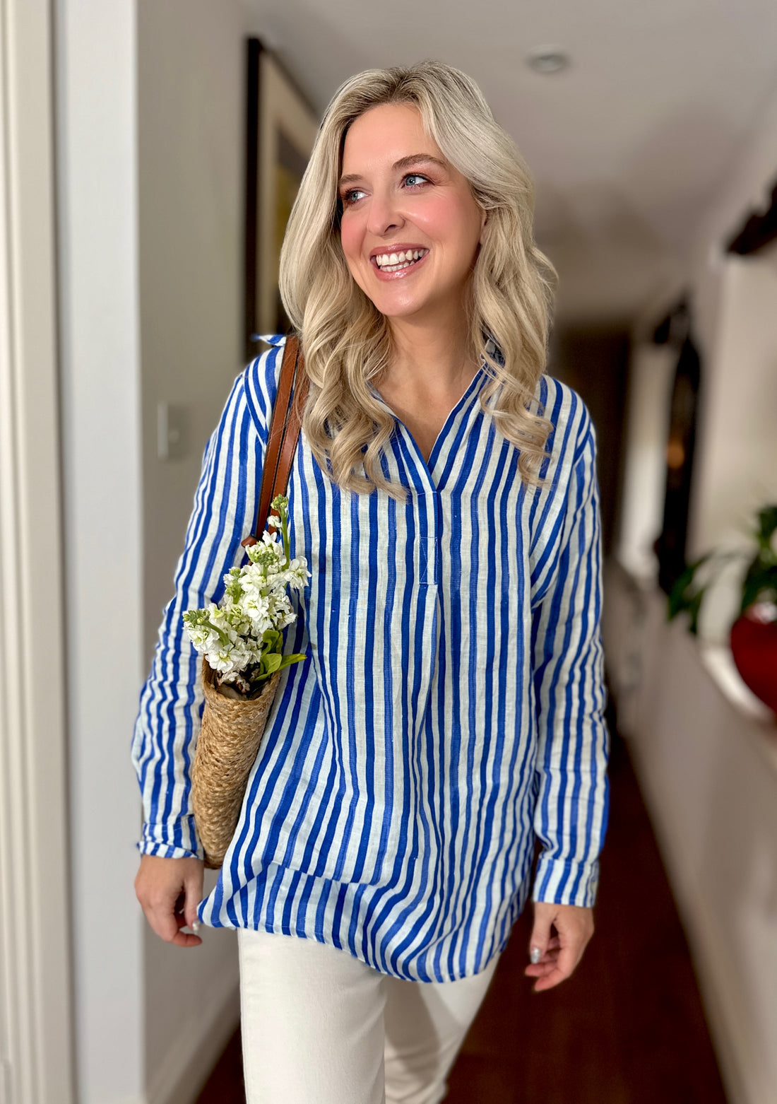 Rosehip Design Julia is a tunic style shirt with bold blue, washed stripes. It&