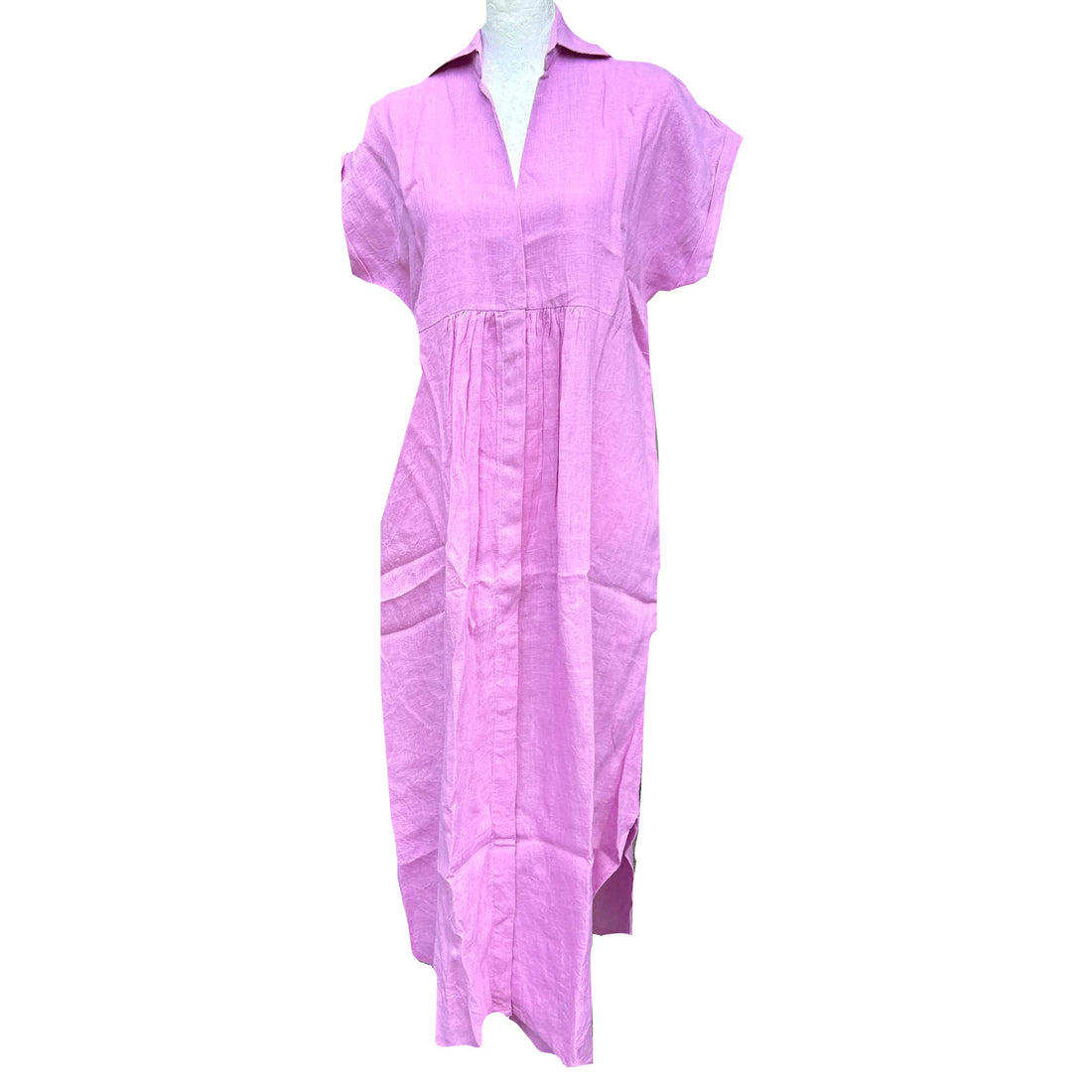 Rosehip Design Kate in our striking Lilac colourway is a magnificent, elegant summer dress made from 100% Linen. It has short, cuffed sleeves, hidden buttons down the front, a few pleats under the bust and curved side slits. 