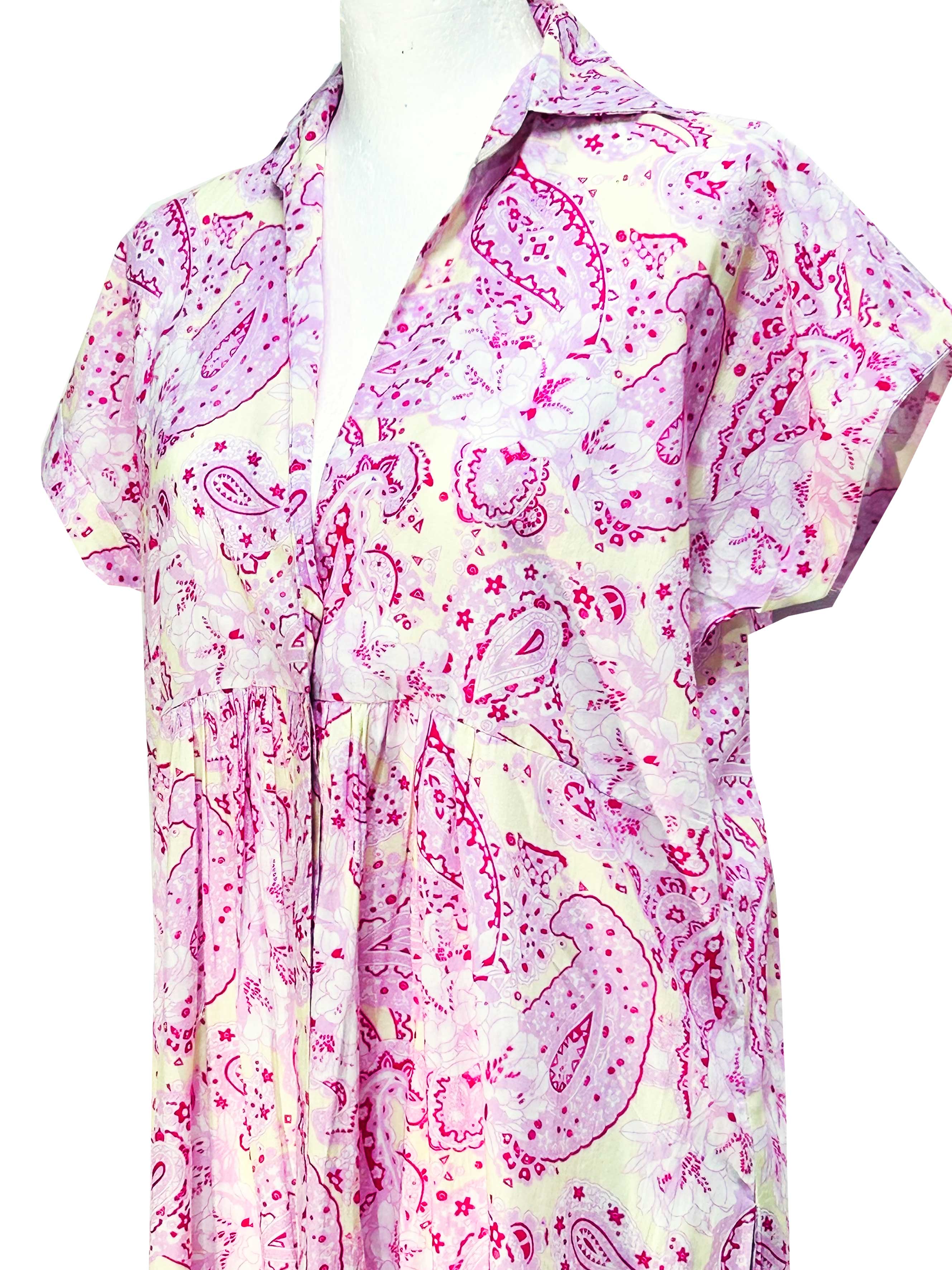 Rosehip Design Kate dress has hidden buttons down the front, short, cuffed sleeves, a few pleats under the bust, side slits and pockets. Rhubarb is a pretty, subtle print in soft pinks on a buttery yellow background. 100% soft Indian Cotton