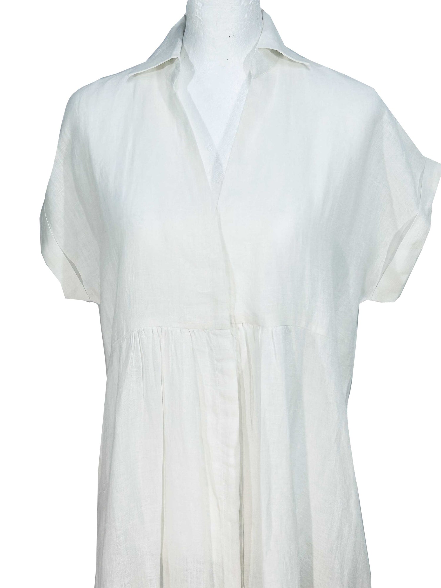 Rosehip Design Kate dress in White is a classic, staple essential for your wardrobe. It has hidden buttons down the front, short, capped sleeves, subtle pleats under the bust, curved side slits, and pockets. Made from 100% pure linen.