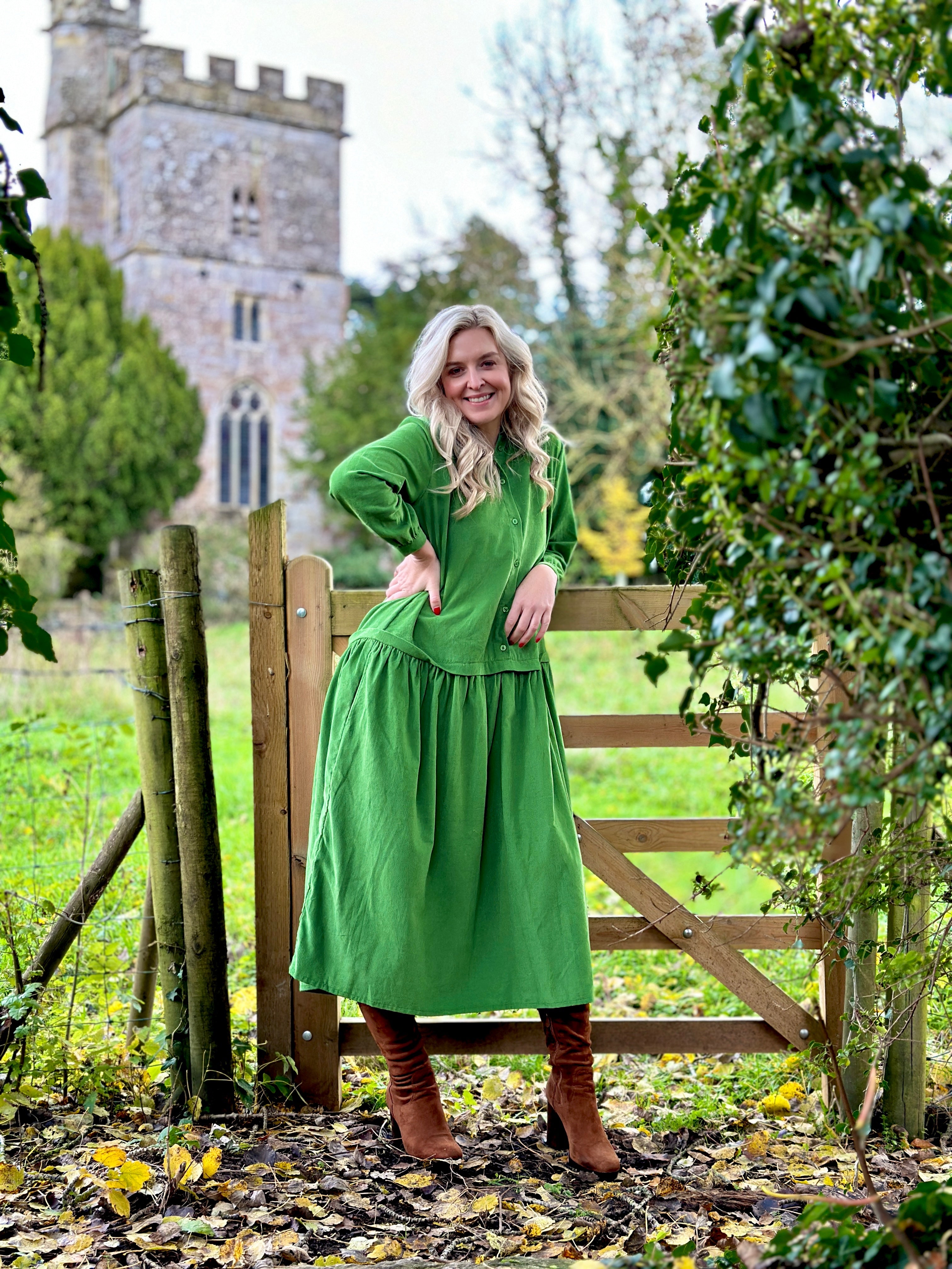 Rosehip Design Laura Dress - step into elegance with our Corduroy Maxi Dress, a perfect fusion of fashion and comfort in verdant Green. This dress boasts a gracefully dropped waist, creating a flattering and relaxed silhouette that effortlessly captures style with ease.