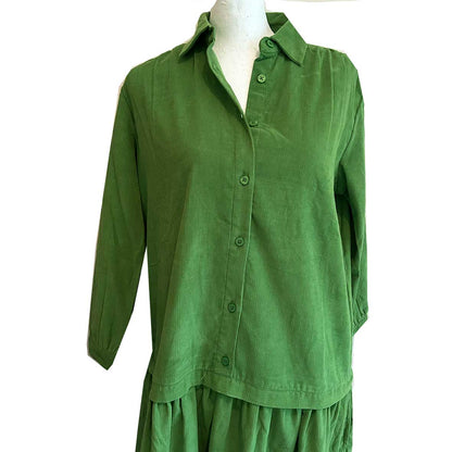 Rosehip Design Laura Dress - step into elegance with our Corduroy Maxi Dress, a perfect fusion of fashion and comfort in verdant Green. This dress boasts a gracefully dropped waist, creating a flattering and relaxed silhouette that effortlessly captures style with ease.