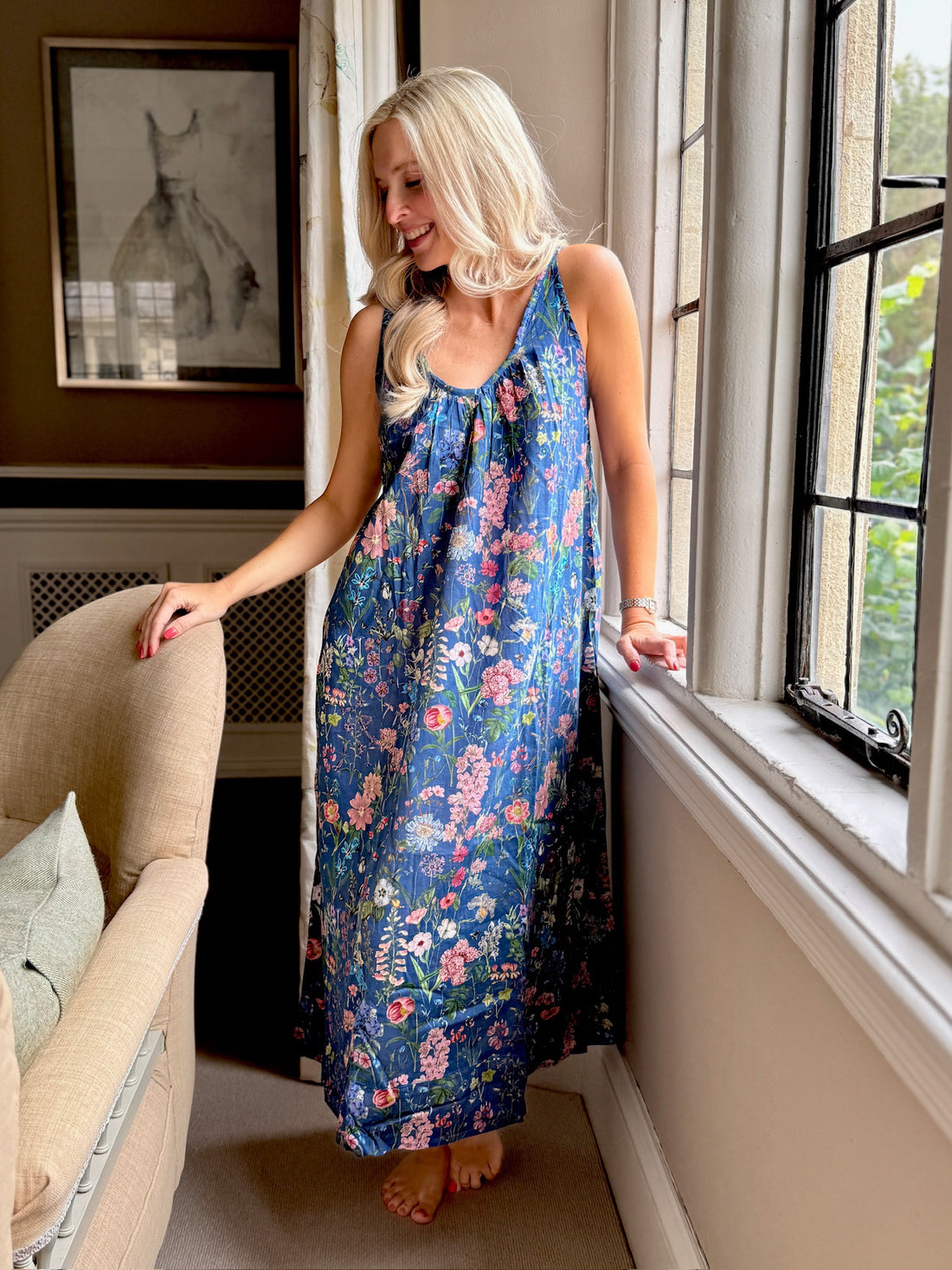 Embrace lightweight comfort with this Rosehip Design long floral cotton nightie dress, perfect for a restful night’s sleep or relaxing around the house. Made from soft, breathable cotton with a charming floral print, this loose-fitting nightdress keeps you cool and comfortable. Designed with adjustable spaghetti straps, it offers a custom fit that suits every body shape. Ideal for warm nights or as an airy, casual loungewear option, this floral nightdress is the perfect blend of style and comfort.