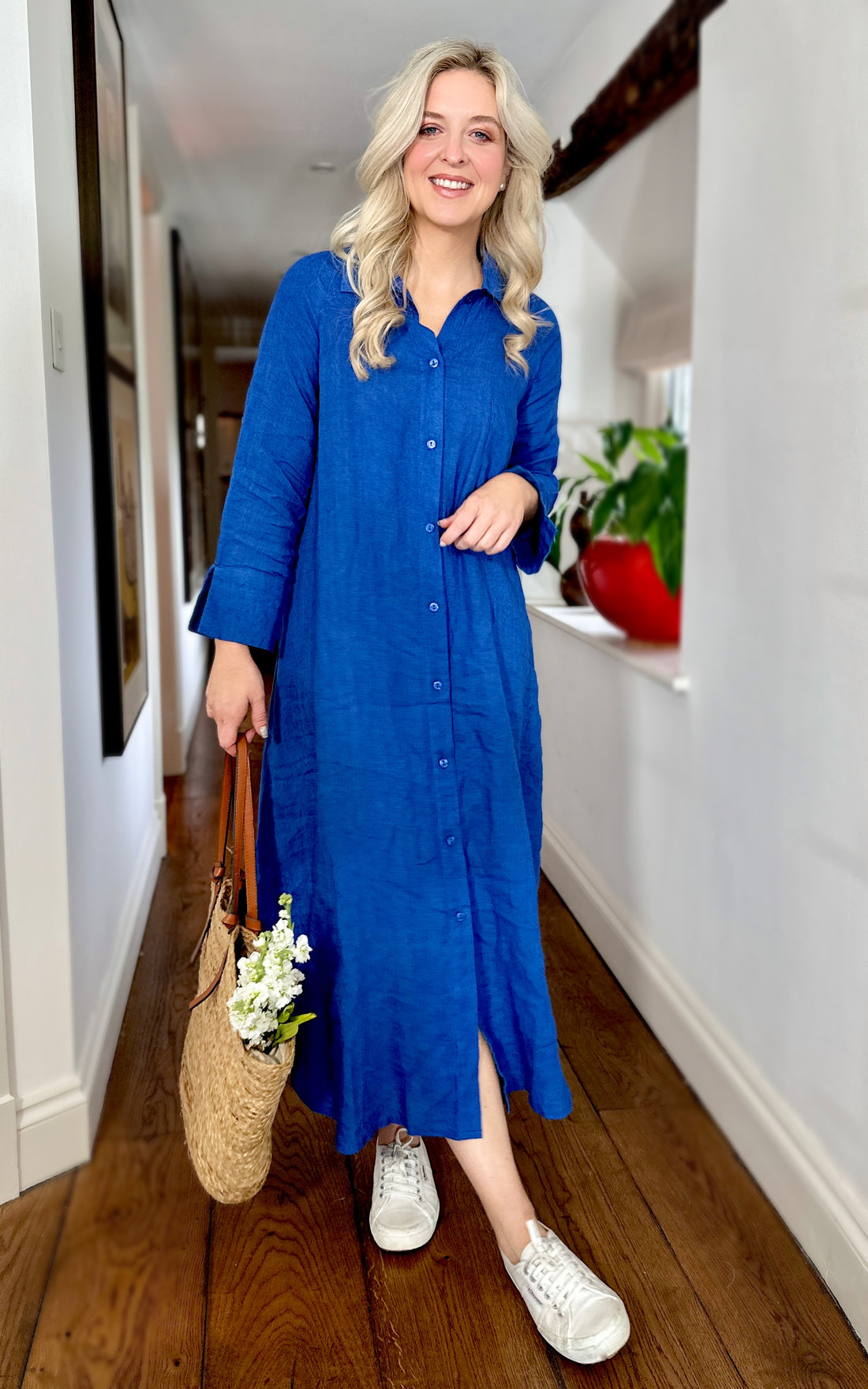 Rosehip Design Lucy Dress is a classic Shirt dress with 3/4 length sleeves, side pockets, front buttons and curved side slits. Made from 100% Linen in brilliant blue Sapphire.