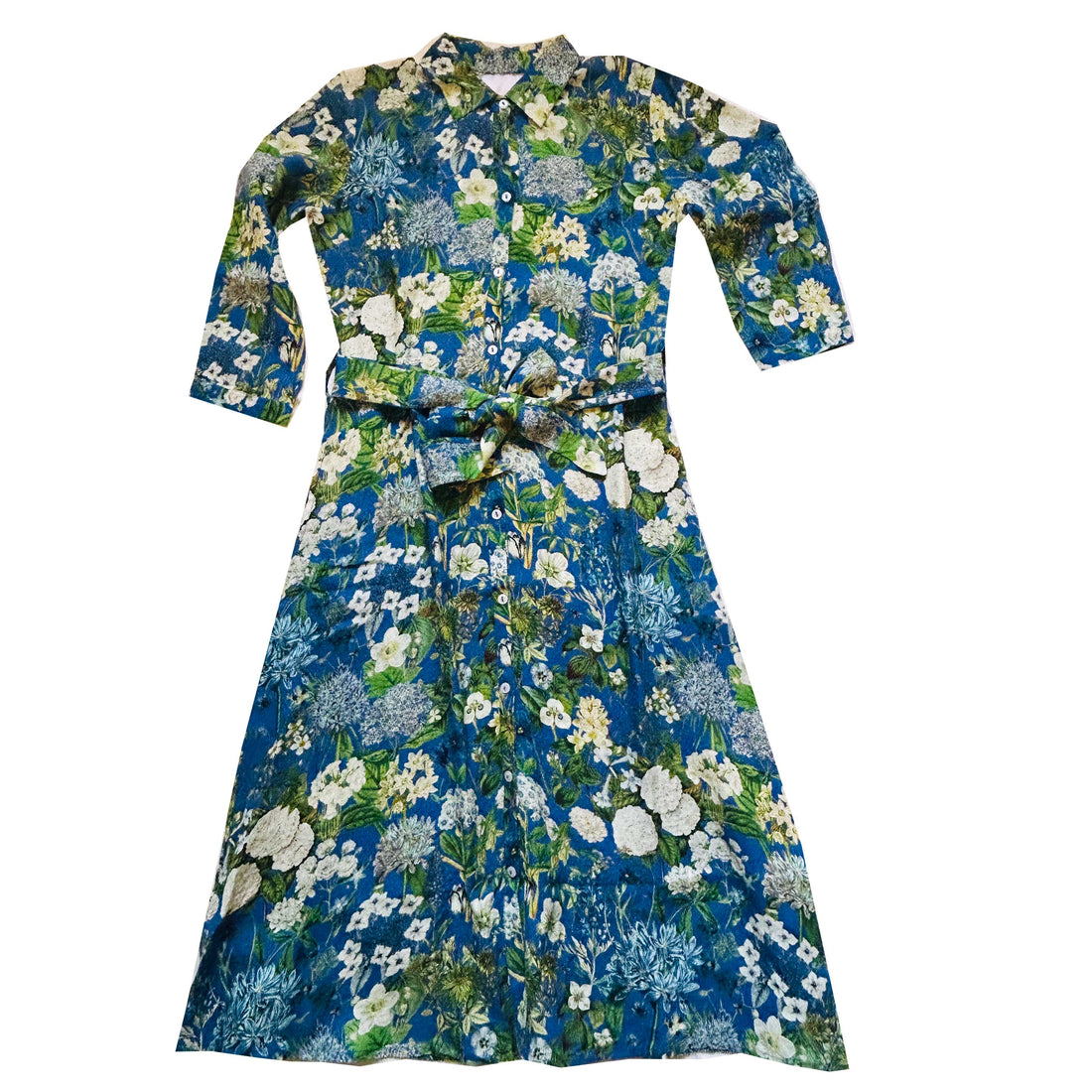 Spring into style with the Rosehip Design Lydia Linen Dress in Spring Blues design. This shirtwaister dress features a beautiful floral design and a fabric tie belt for a flattering fit. With its long sleeves and button-up front, this dress is the perfect combination of comfort and chic. Ready to bloom in your wardrobe!