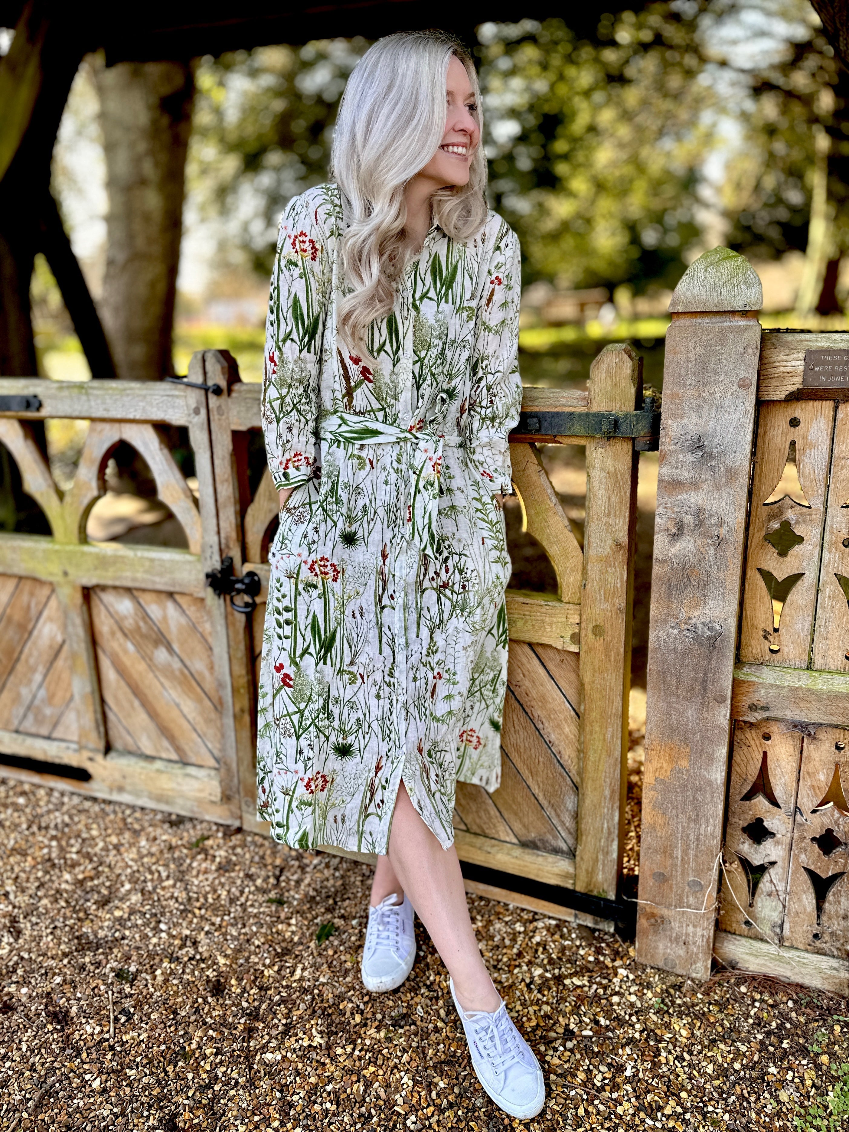 Spring into style with the Rosehip Design Lydia Linen Dress in Wildgrass design. This shirtwaister dress features a beautiful floral design and a fabric tie belt for a flattering fit. With its long sleeves and button-up front, this dress is the perfect combination of comfort and chic. Ready to bloom in your wardrobe!