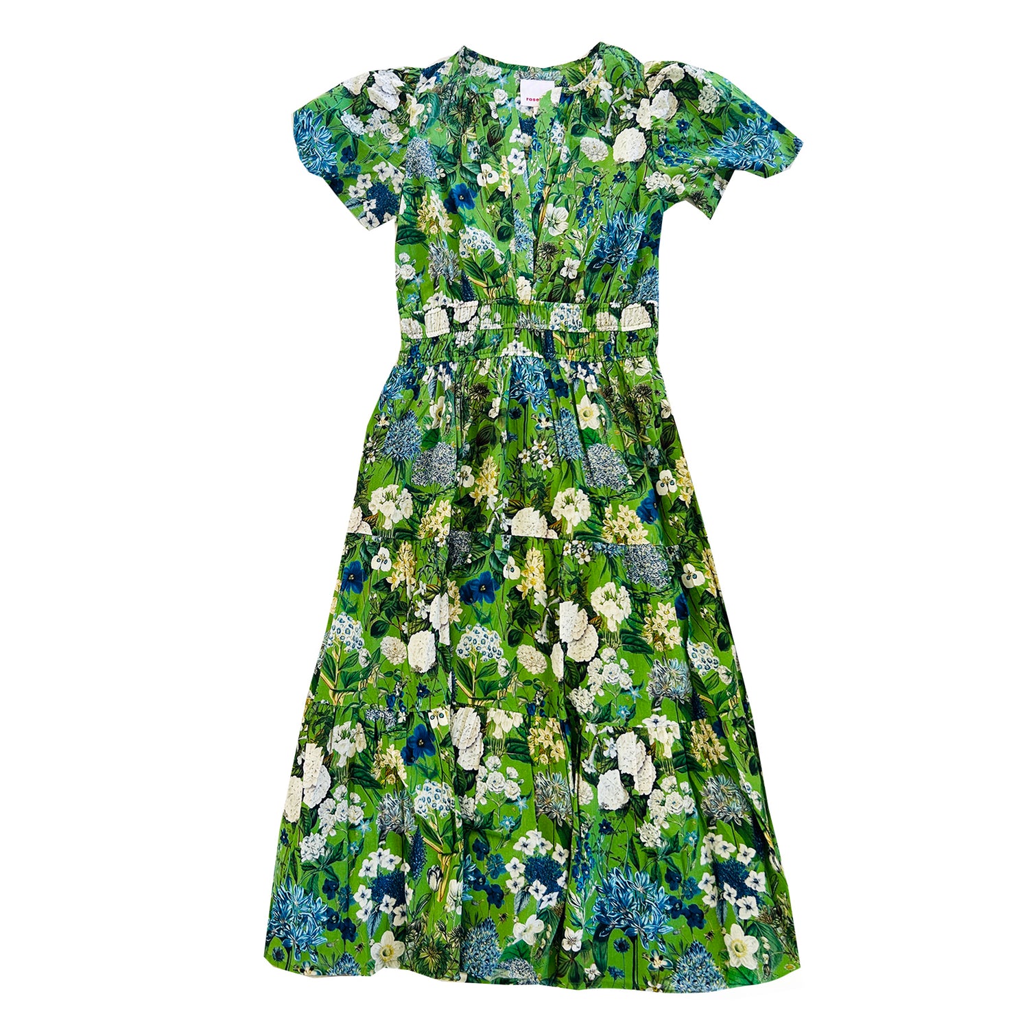 The Rosehip Design Margot cotton dress in Spring Greens is a beautifully feminine and effortless dress, designed for all-day comfort. Featuring a double elasticated waistband for a flattering fit, a flowing tiered skirt, and short capped sleeves, it blends elegance with ease. With the added practicality of pockets, it’s perfect for both casual outings and special occasions