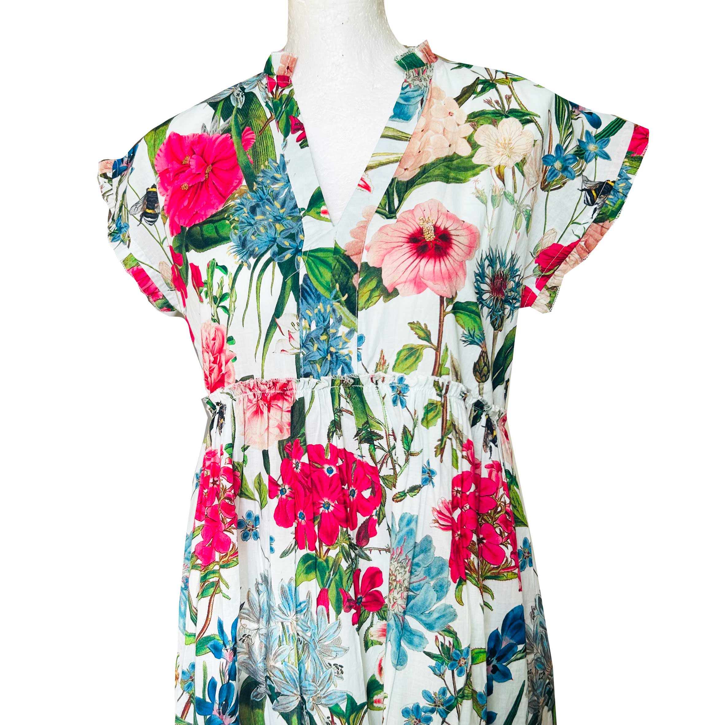 Rosehip Design Olivia is a beautiful cotton dress in our beautiful Lavington floral print. The Olivia dress has short, capped sleeves with a rough frill. The skirt is tiered and has pockets.