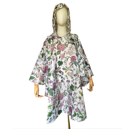 Stand out from the crowd in a beautiful floral Rain Poncho from Rosehip Design. It brings a splash of colour to rainy days offering both style and protection. Featuring vibrant floral prints combining fashion with functionality. Made from lightweight, waterproof material, the Rosehip Rain Poncho is designed for easy portability, folding neatly into a compact drawstring bag. Ideal for on-the-go use, ensuring you stay dry without sacrificing style.