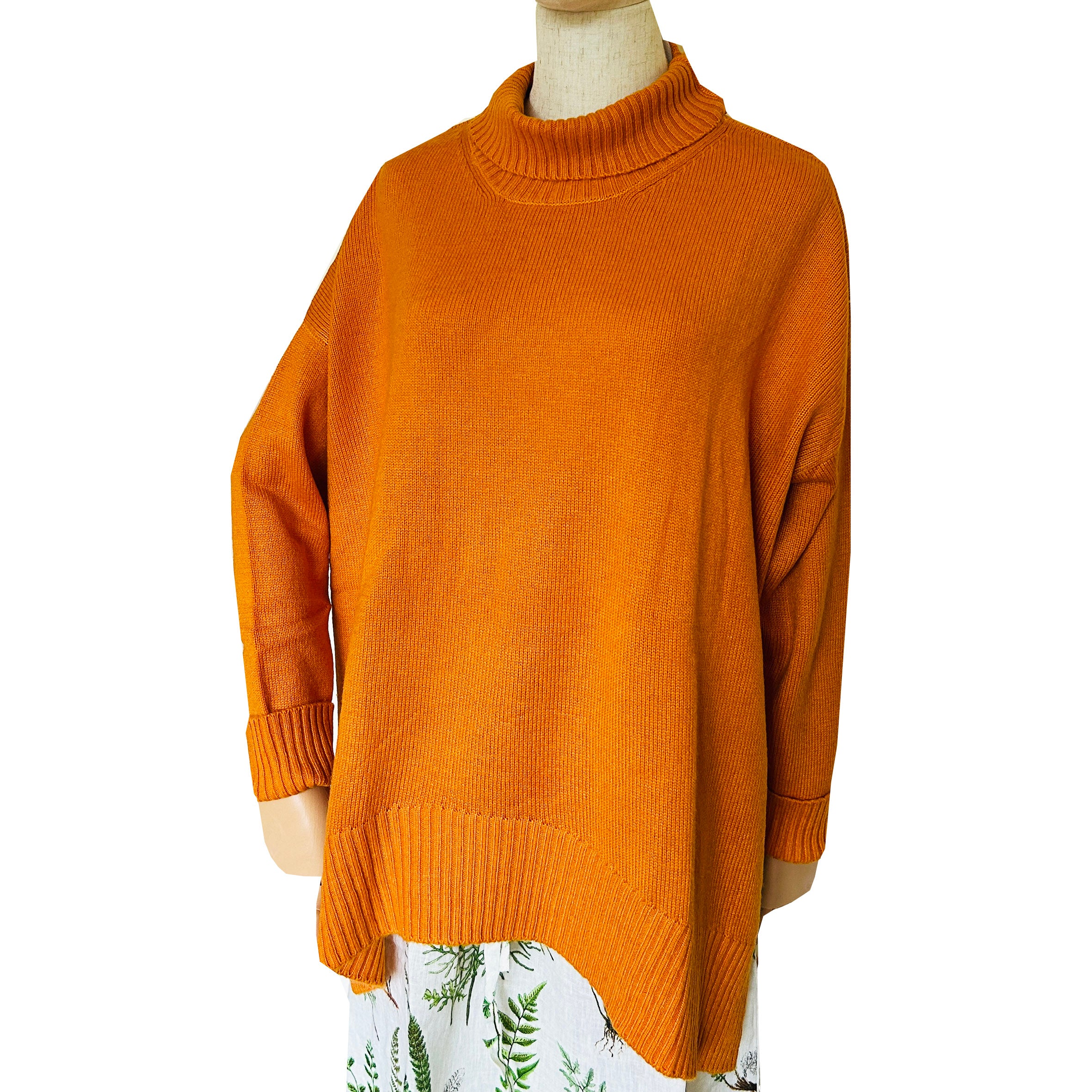 Stay effortlessly stylish and snug in this Rosehip Design woollen roll neck jumper, designed with a modern high-low hem that falls longer at the back for a flattering, easy silhouette. Crafted from soft, warming wool, it offers both comfort and elegance — perfect for layering on chilly days. The classic roll neck adds a touch of sophistication, while the relaxed fit makes it a versatile wardrobe staple you’ll reach for all season.