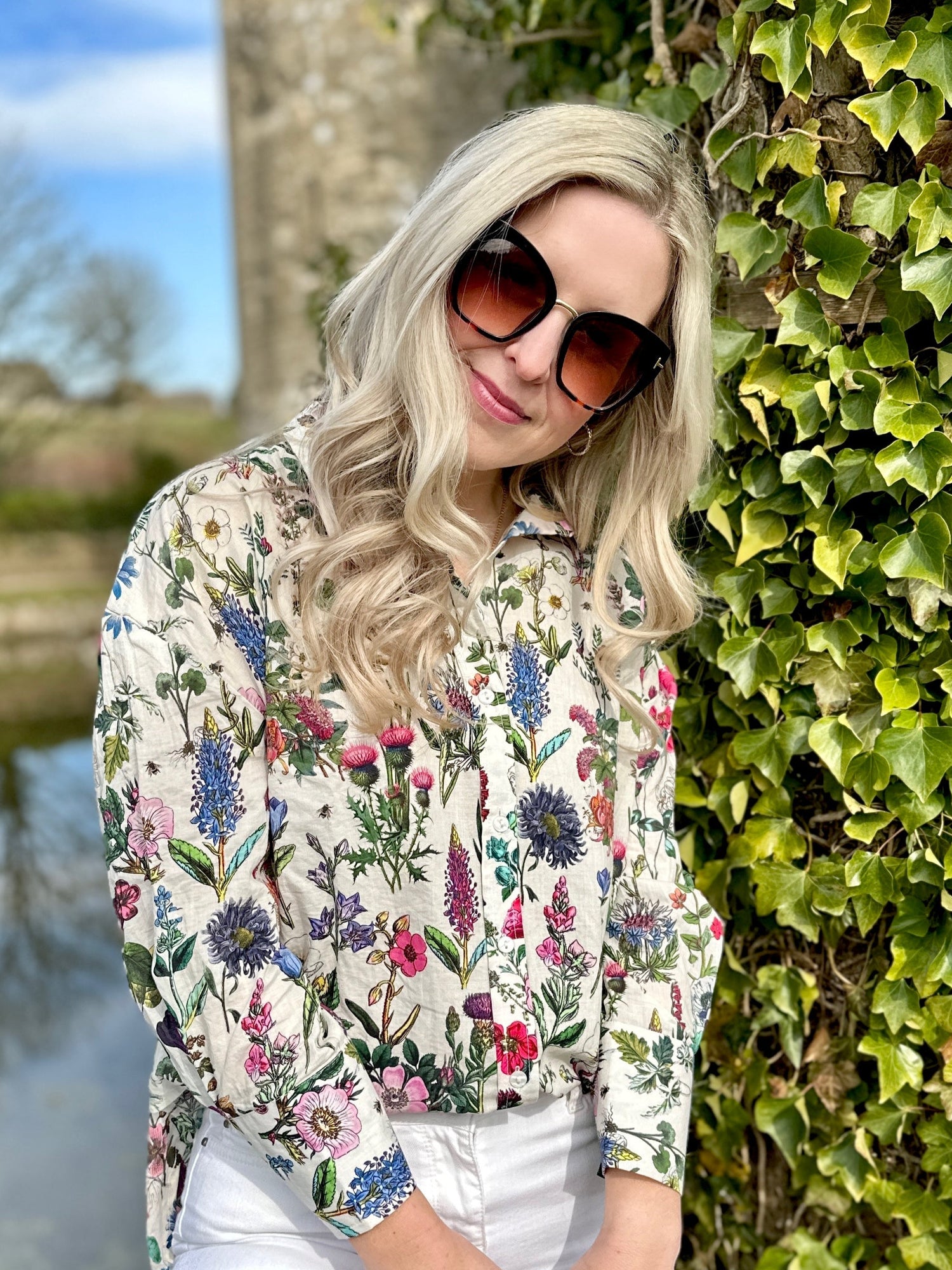 The Rosehip Design Sarah Cotton Shirt is a timeless wardrobe staple, made of soft cotton. It features a classic button-down front, elegant sleeves that end just before the wrist, and a gently curved hem for a relaxed yet polished look.

Featuring our vibrant Barcelona print, this shirt is a celebration of summer, bursting with lively hues and intricate floral patterns. Perfect for warm-weather styling, it pairs beautifully with the matching Sally Skirt for a coordinated ensemble, or just jeans.