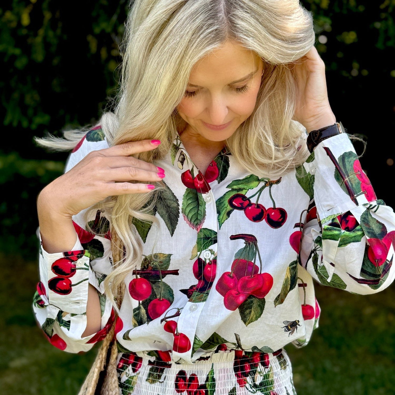 The Rosehip Design Sarah Cotton Shirt is a timeless wardrobe staple, made of soft cotton. It features a classic button-down front, elegant sleeves that end just before the wrist, and a gently curved hem for a relaxed yet polished look.

Featuring our vibrant Barcelona print, this shirt is a celebration of summer, bursting with lively hues and intricate floral patterns. Perfect for warm-weather styling, it pairs beautifully with the matching Sally Skirt for a coordinated ensemble, or just jeans.