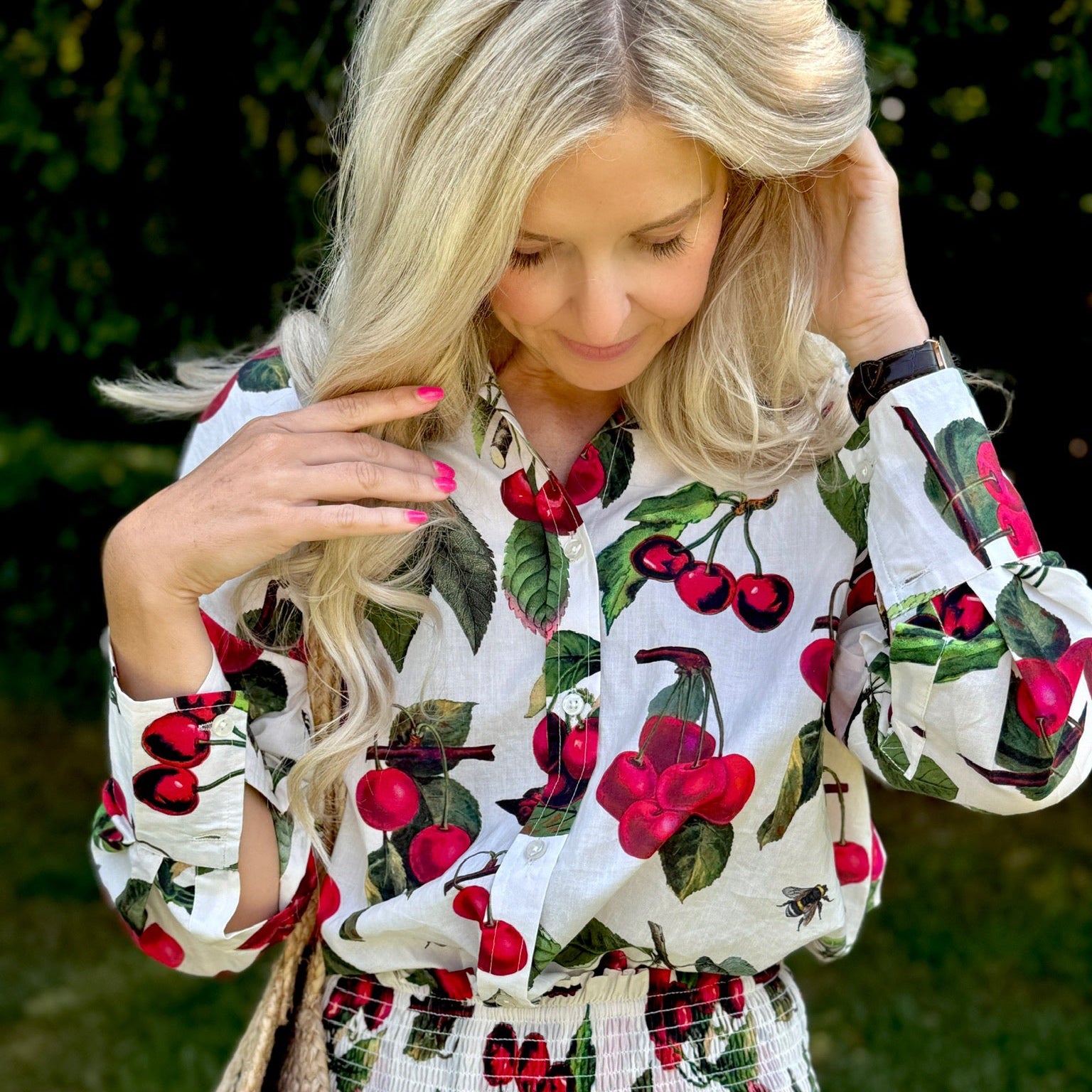 The Rosehip Design Sarah Cotton Shirt is a timeless wardrobe staple, made of soft cotton. It features a classic button-down front, elegant sleeves that end just before the wrist, and a gently curved hem for a relaxed yet polished look.

Featuring our vibrant Barcelona print, this shirt is a celebration of summer, bursting with lively hues and intricate floral patterns. Perfect for warm-weather styling, it pairs beautifully with the matching Sally Skirt for a coordinated ensemble, or just jeans.