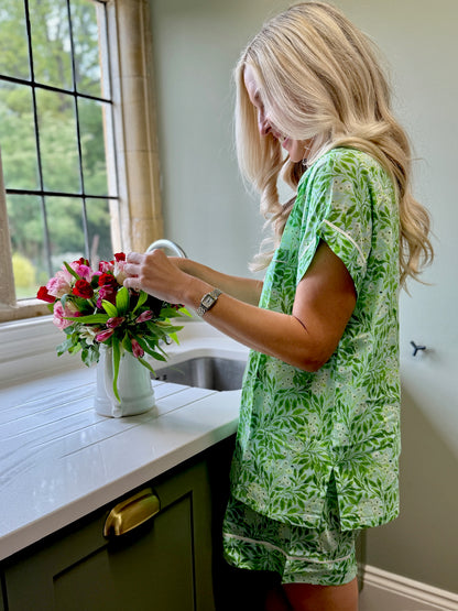 A lovely Rosehip Design short pyjama set in cotton voile with floral print. The top is buttoned with piping detail and the shorts are elasticated and have a drawstring.