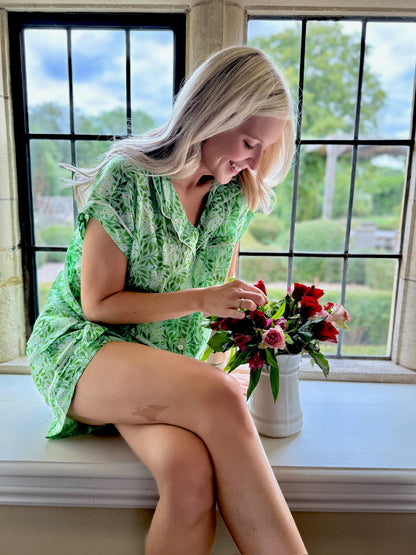 A lovely Rosehip Design short pyjama set in cotton voile with floral print. The top is buttoned with piping detail and the shorts are elasticated and have a drawstring.