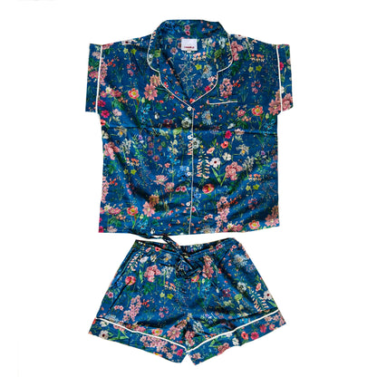 A lovely Rosehip Design short pyjama set in cotton voile with floral print. The top is buttoned with piping detail and the shorts are elasticated and have a drawstring.