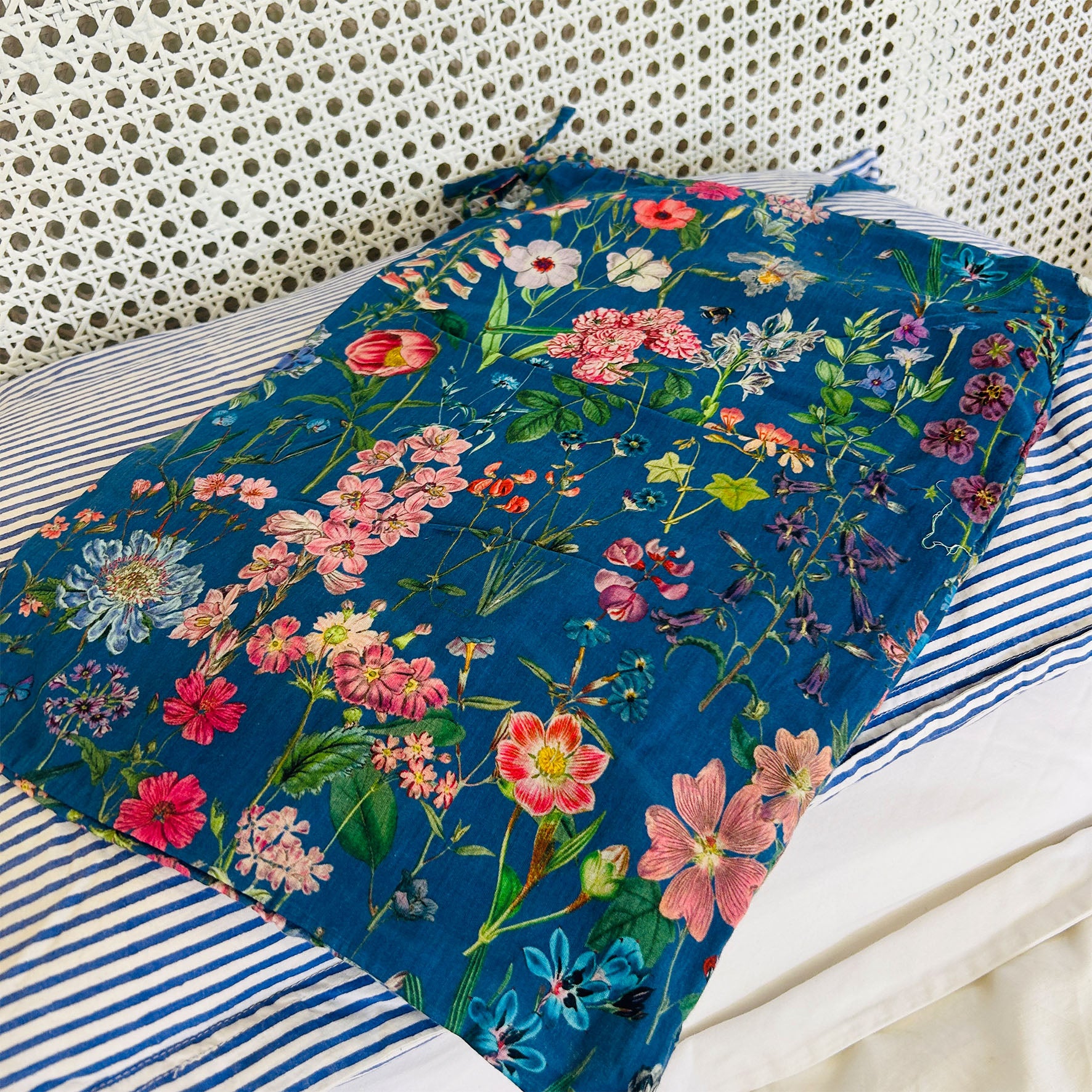 A lovely Rosehip Design short pyjama set in cotton voile with floral print. The top is buttoned with piping detail and the shorts are elasticated and have a drawstring.