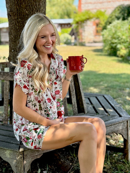 A lovely Rosehip Design short pyjama set in cotton voile with floral print. The top is buttoned with piping detail and the shorts are elasticated and have a drawstring.