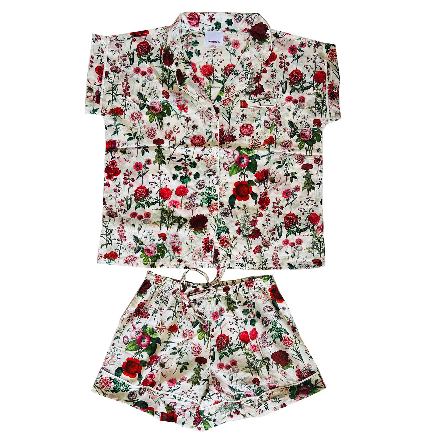 A lovely Rosehip Design short pyjama set in cotton voile with floral print. The top is buttoned with piping detail and the shorts are elasticated and have a drawstring.