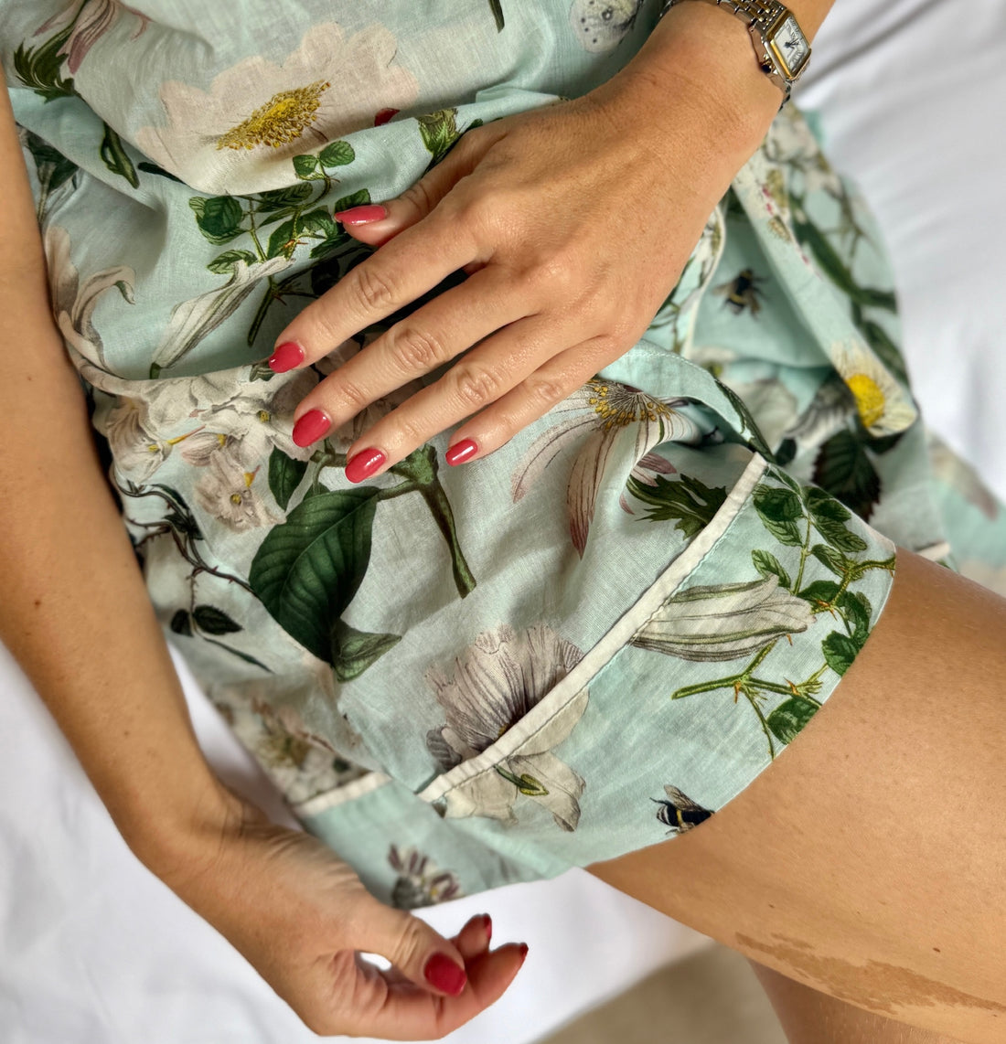 A lovely shirt and short Rosehip Design Pyjama set in cotton voile with floral print. The shirt is buttoned with piping details. The shorts are elasticated and have a drawstring.