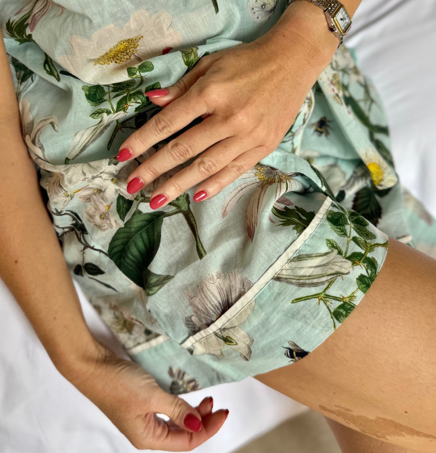 A lovely shirt and short Rosehip Design Pyjama set in cotton voile with floral print. The shirt is buttoned with piping details. The shorts are elasticated and have a drawstring.