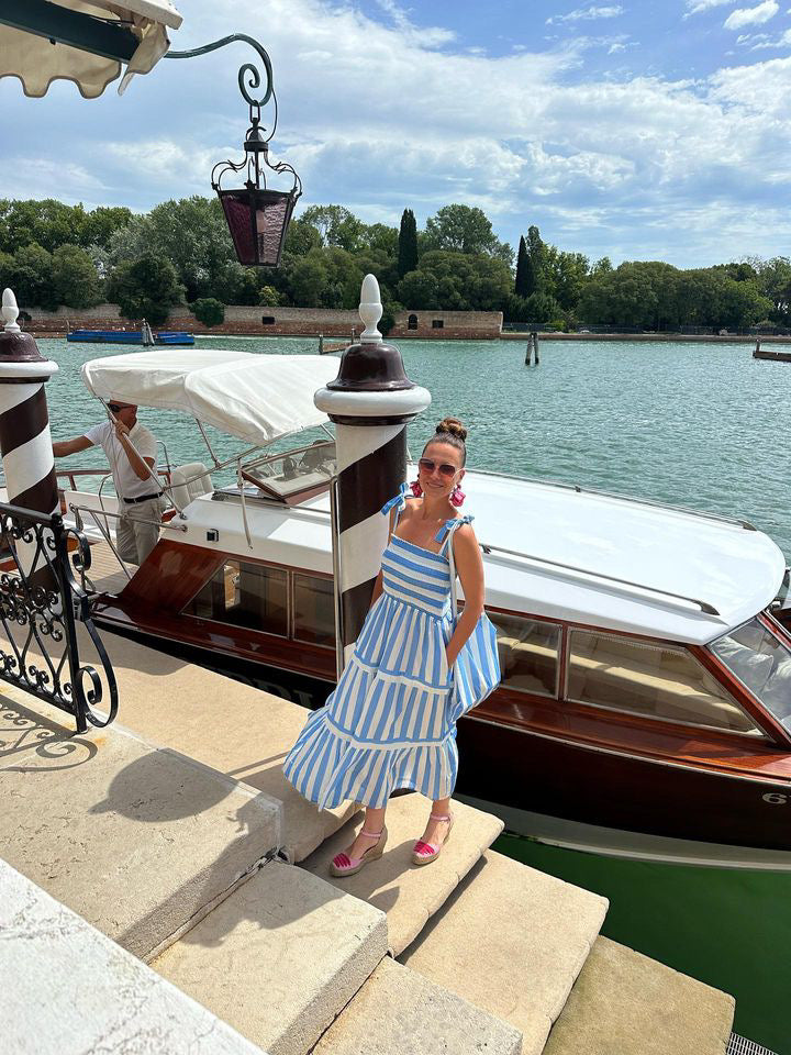 Rosehip Design Tropez Sundress is a gorgeous Summer dress featuring a shirred top with straps and a long flowing skirt with pockets. Perfect beachwear in our wide Periwinkle blue and white stripes design.