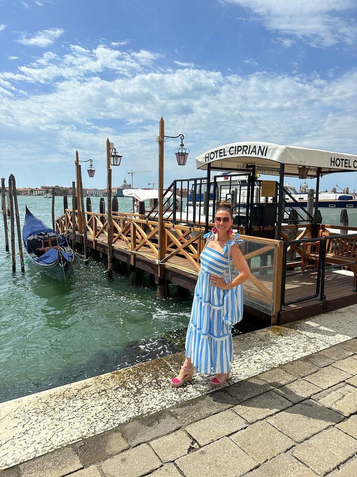 Rosehip Design Tropez Sundress is a gorgeous Summer dress featuring a shirred top with straps and a long flowing skirt with pockets. Perfect beachwear in our wide Periwinkle blue and white stripes design.