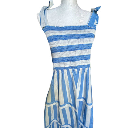 Rosehip Design Tropez Sundress is a gorgeous Summer dress featuring a shirred top with straps and a long flowing skirt with pockets. Perfect beachwear in our wide Periwinkle blue and white stripes design.