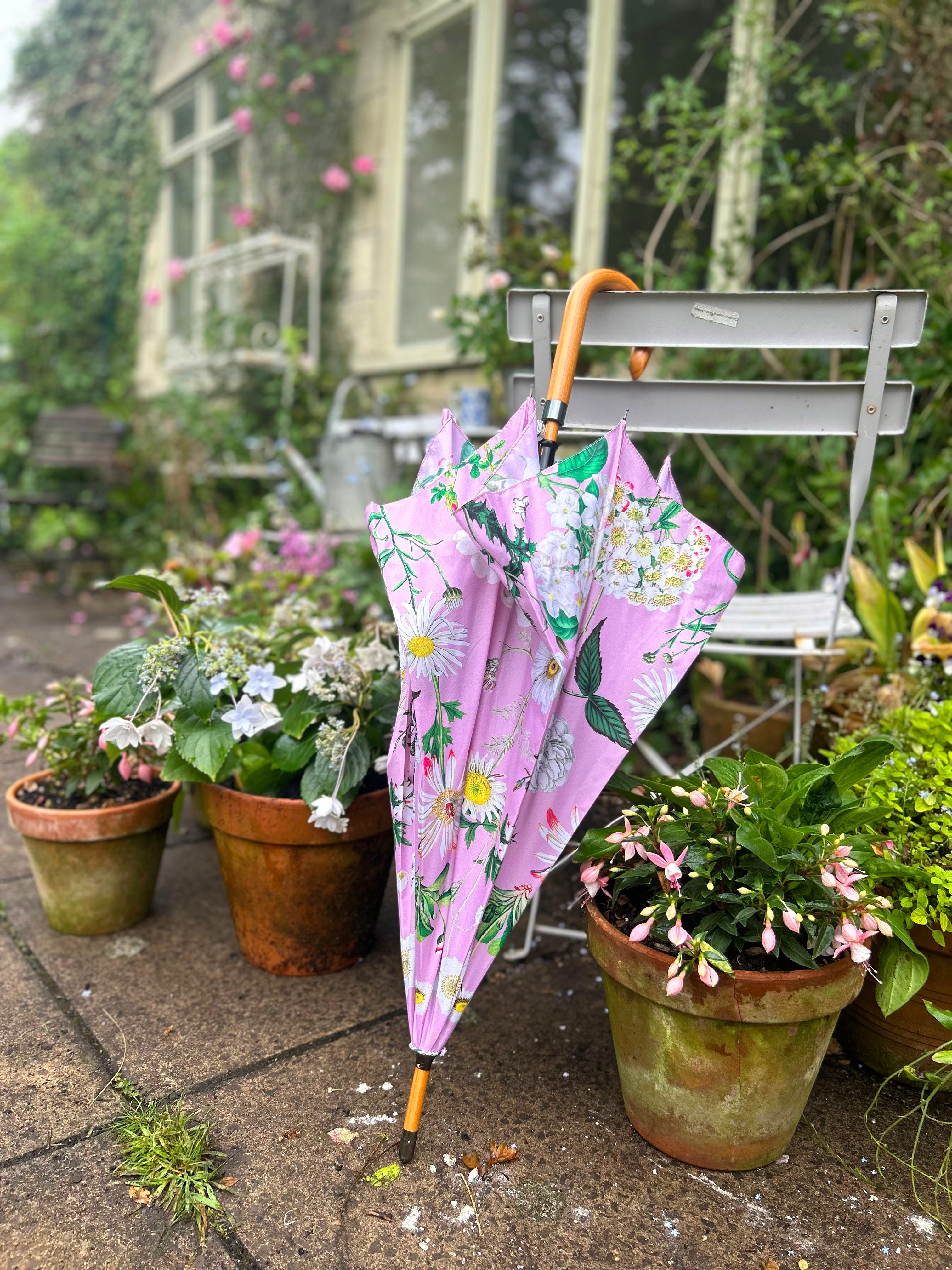 Rosehip Design Walking Umbrella is a sturdy, practical and waterproof rain umbrella with an auto pop-up button and wooden handle. Stand out from the crowd with our soothing Heavenly Rose Design.