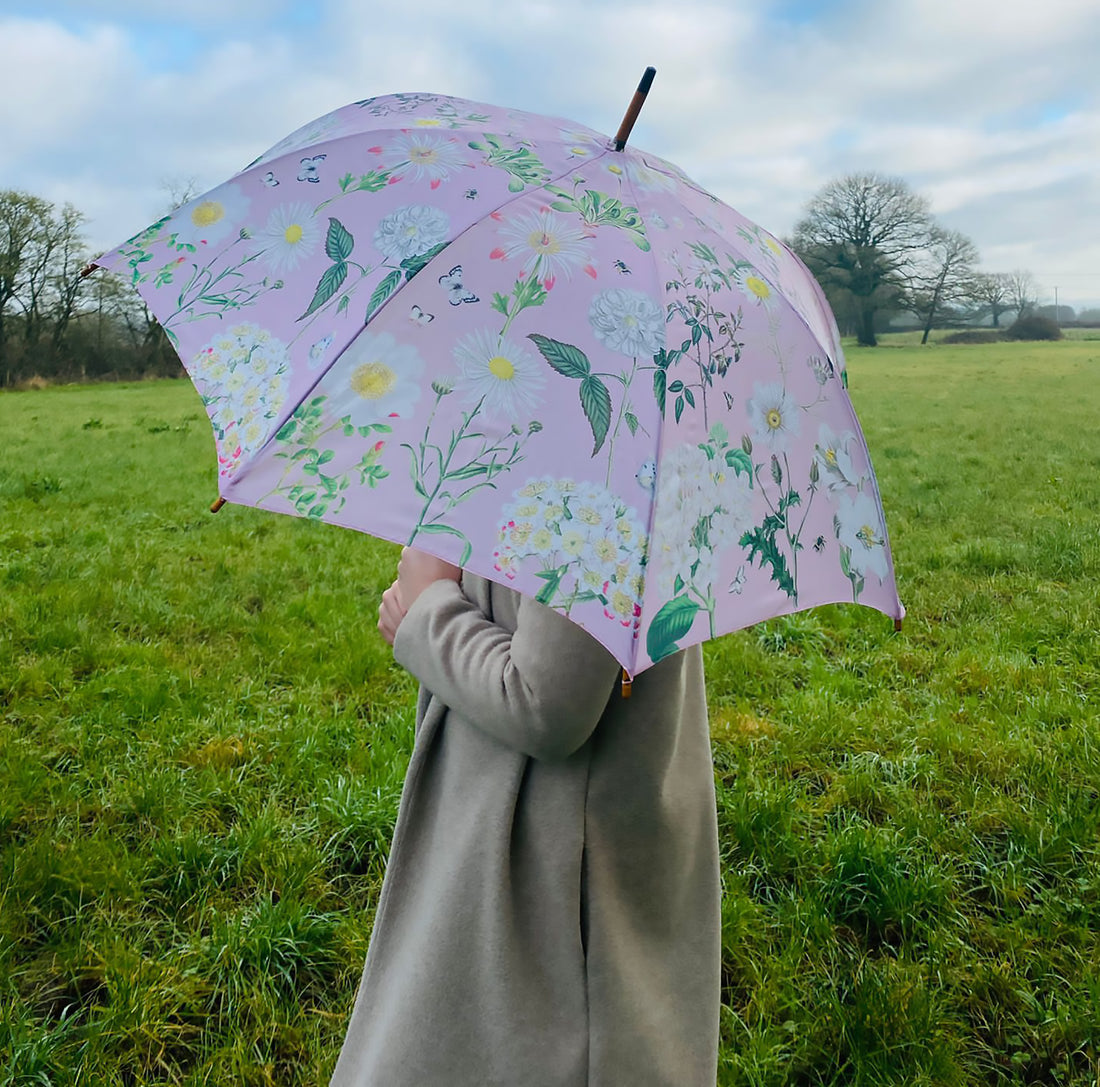 Rosehip Design Walking Umbrella is a sturdy, practical and waterproof rain umbrella with an auto pop-up button and wooden handle. Stand out from the crowd with our soothing Heavenly Rose Design.