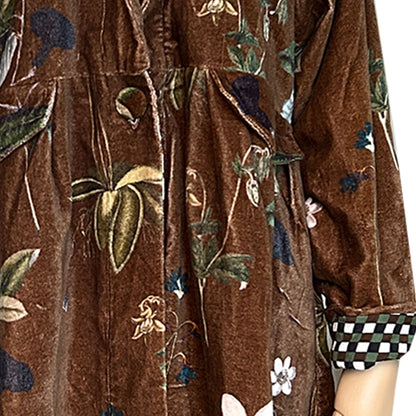 Wrap yourself in autumn warmth with this long velvet coat in a rich Rosehip Design Winter Floral that perfectly echoes the season. The soft velvet exterior is complemented by a classic check lining, adding a touch of style to its bold, modern silhouette. Luxuriously warm yet effortlessly wearable, it’s the perfect layer for crisp autumn days — whether you’re strolling through the countryside or heading into the city.