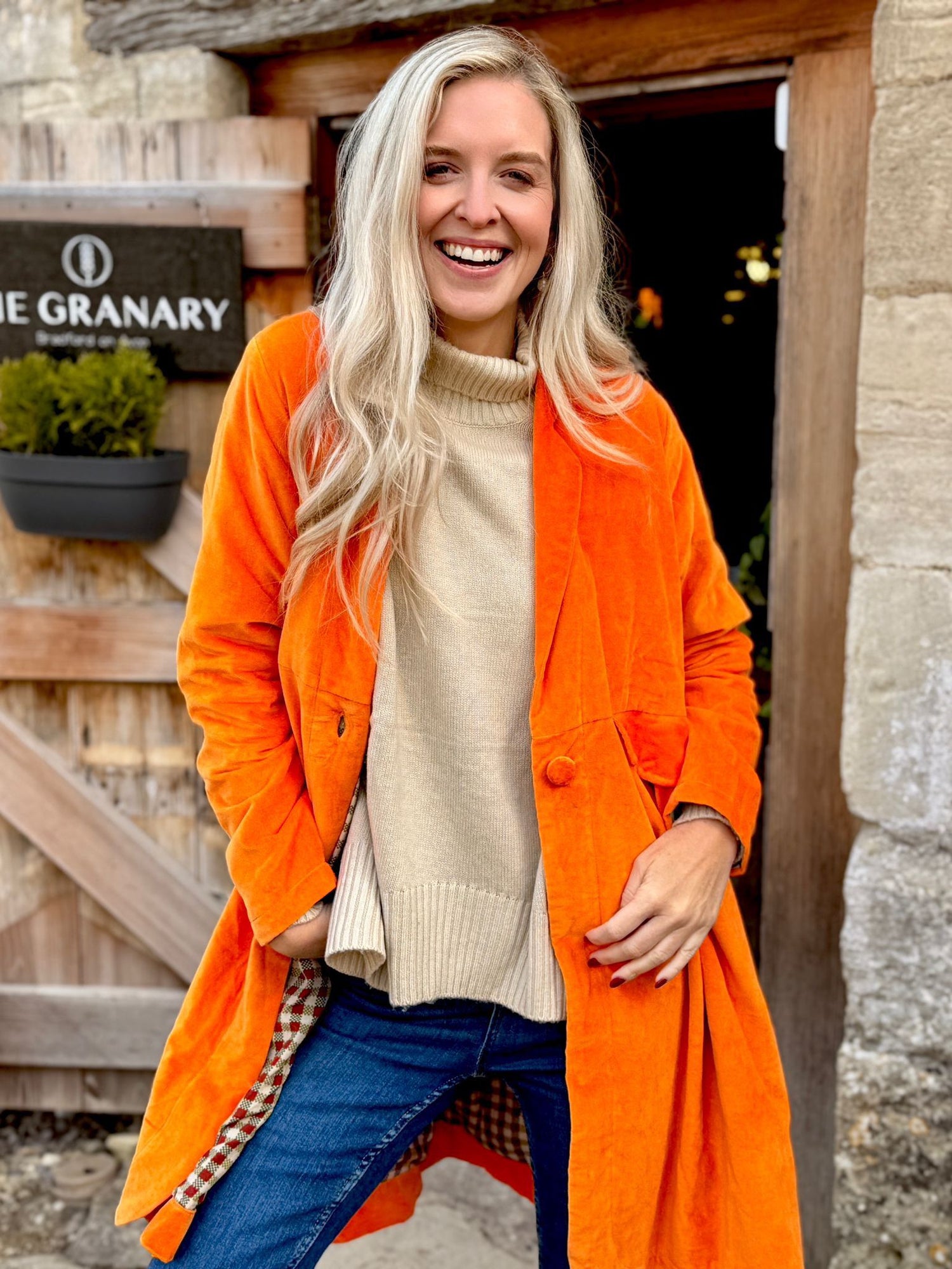 Wrap yourself in autumn warmth with this Rosehip Design statement velvet coat, in a rich, vibrant orange that perfectly echoes the season. The soft velvet exterior is complemented by a classic check lining, adding a touch of timeless style to its bold, modern silhouette. Luxuriously warm yet effortlessly wearable, it’s the perfect layer for crisp autumn days — whether you’re strolling through the countryside or heading into the city.