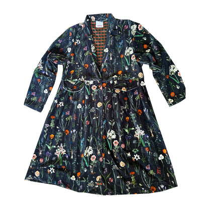 Wrap yourself in autumn warmth with this statement velvet coat, in a rich, vibrant orange that perfectly echoes the season. The soft velvet exterior is complemented by a classic check lining, adding a touch of timeless style to its bold, modern silhouette. Luxuriously warm yet effortlessly wearable, it’s the perfect layer for crisp autumn days — whether you’re strolling through the countryside or heading into the city.