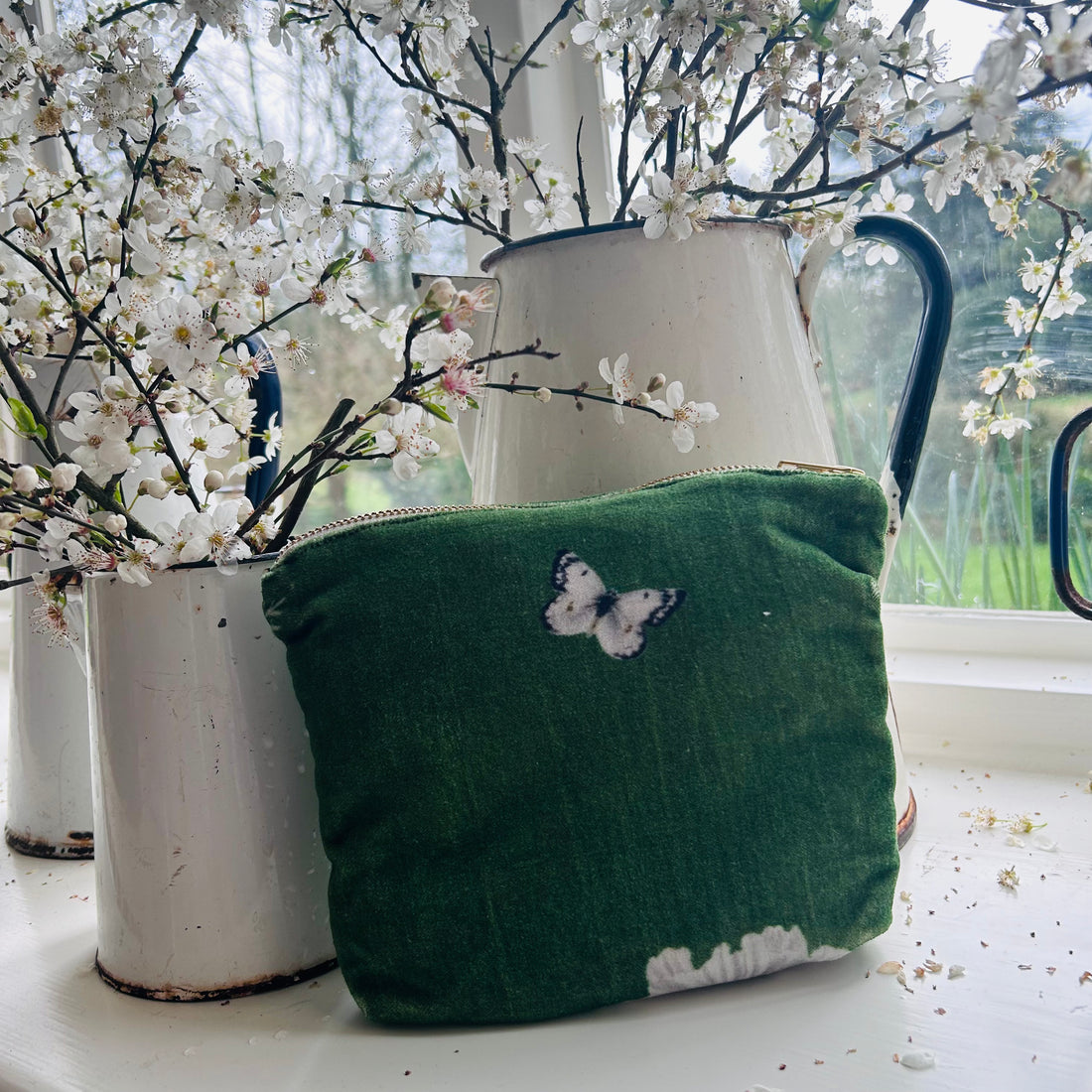 Rosehip Design Velvet Pouch is a practical cosmetic bag printed in our verdant Heavenly Green design on velvet. It is lined with a small pocket inside.