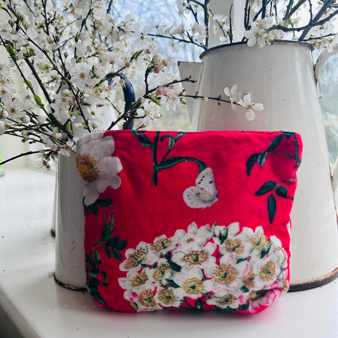 Rosehip Design Velvet Pouch is a practical cosmetic bag printed in our striking Peony Siren design on velvet. It is lined with a small pocket inside.