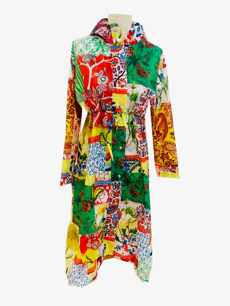 Rosehip Design Windsor Parka is a practical light-weight calf-length summer parka in our funky Patchwork Floral design. It features a long tiered skirt, drawstring waist and fully lined hood.