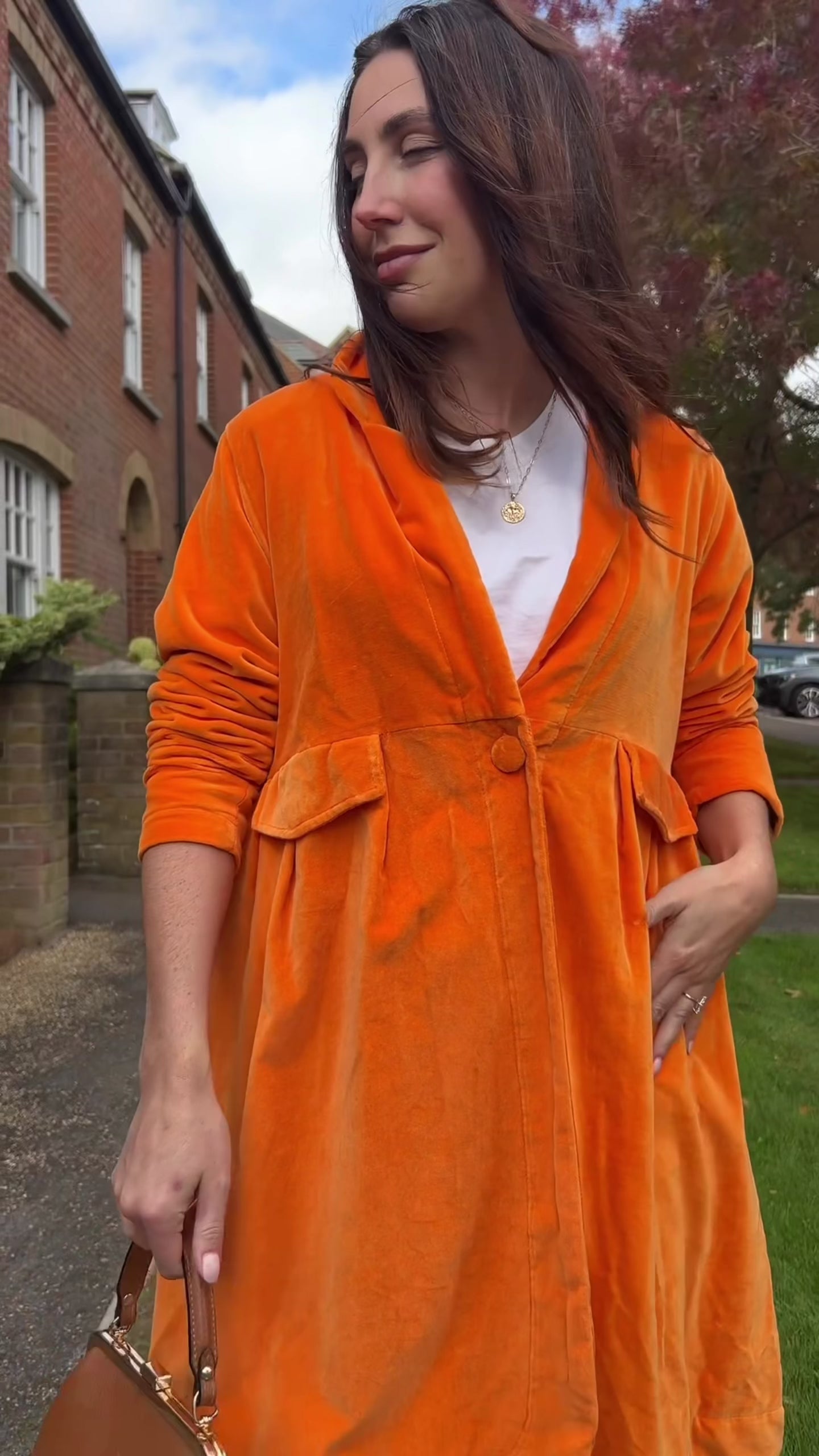 Wrap yourself in autumn warmth with this Rosehip Design statement velvet coat, in a rich, vibrant orange that perfectly echoes the season. The soft velvet exterior is complemented by a classic check lining, adding a touch of timeless style to its bold, modern silhouette. Luxuriously warm yet effortlessly wearable, it’s the perfect layer for crisp autumn days — whether you’re strolling through the countryside or heading into the city.